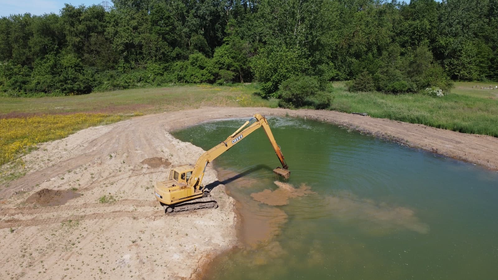 Crawler crane working at the water's edge