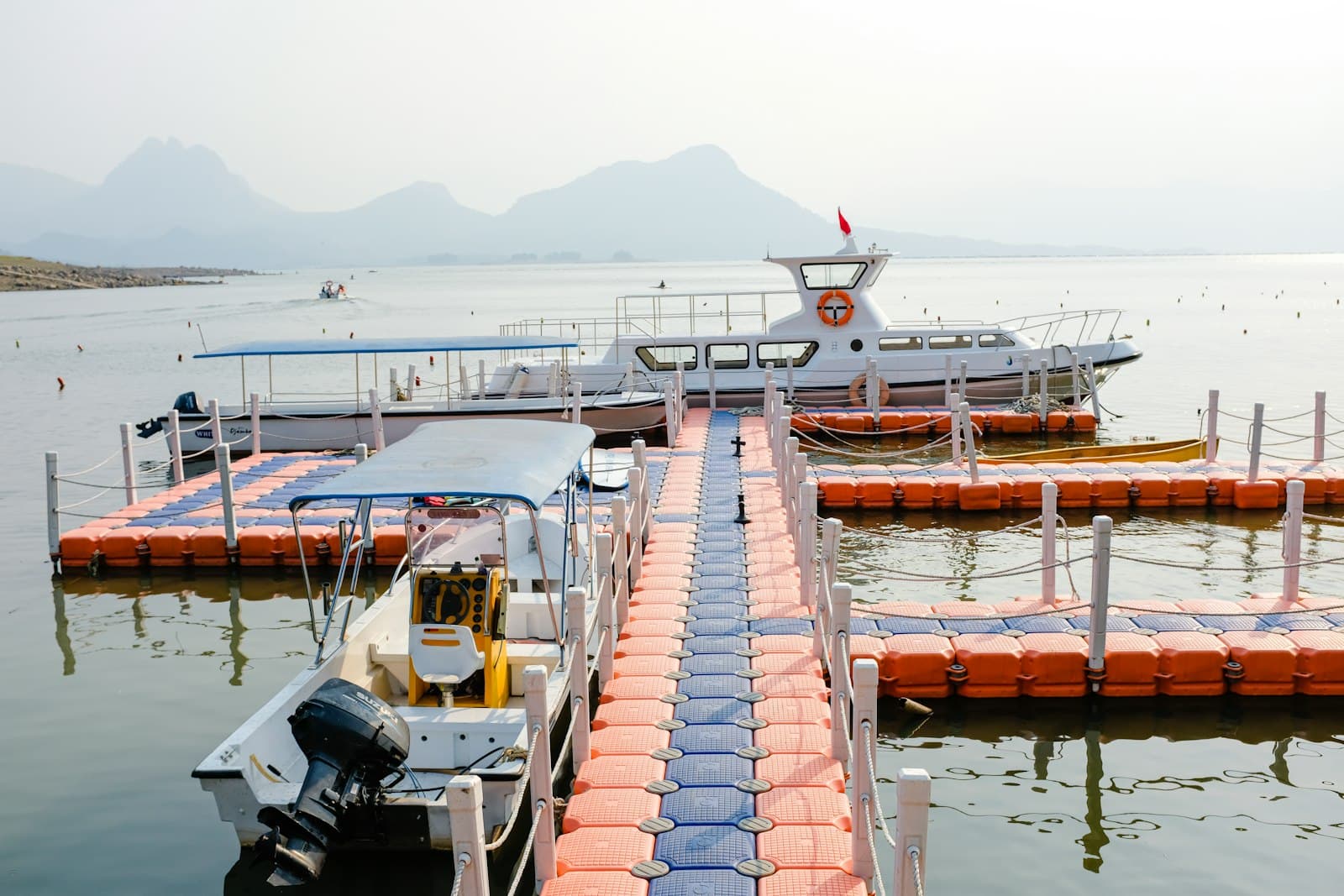 Work boats rafted along a floating dock