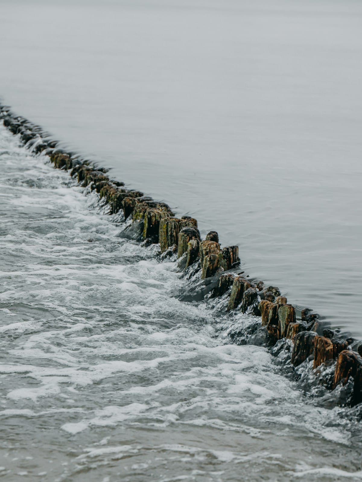 Fresh rock revetment line running along the channel